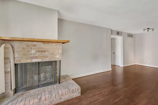 a bedroom with a bed and a fireplace