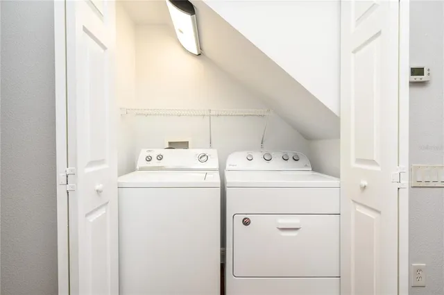 a utility room with dryer and washer