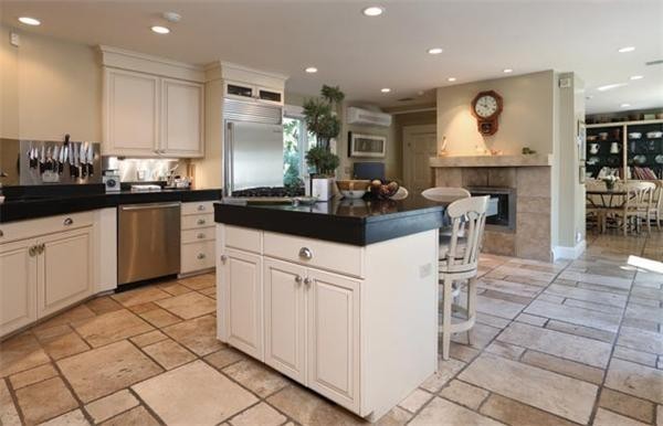 63 May Street Boston, MA 02130 - Photo 5 of 11 a kitchen with stainless steel appliances granite countertop a sink and cabinets