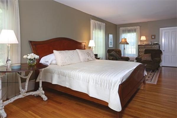 63 May Street Boston, MA 02130 - Photo 7 of 11 a bedroom with bed and wooden floor