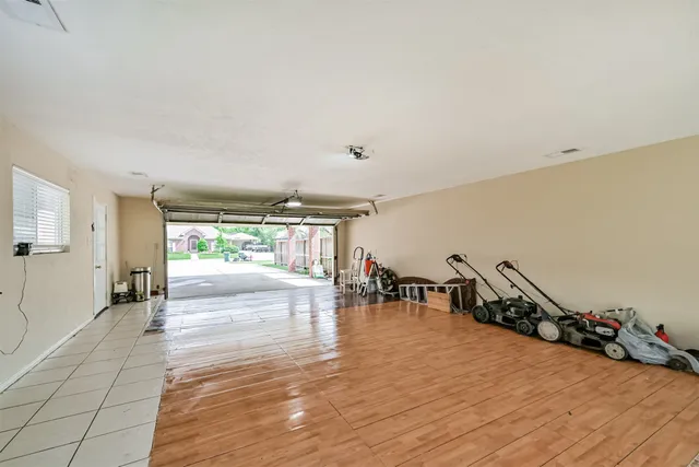 a view of a room with lots of wooden furniture