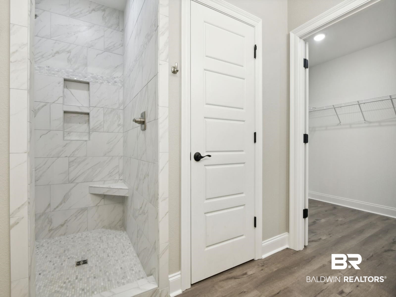 12922 Gondala Street Elberta, AL 36530 - Photo 17 of 20 Full bathroom with a walk in closet, wood finished floors, and a shower stall