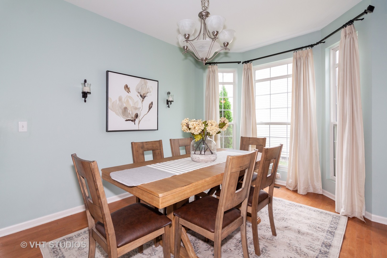317 Stonegate Road Bolingbrook, IL 60440 - Photo 5 of 23 a view of a dining room with furniture window and wooden floor
