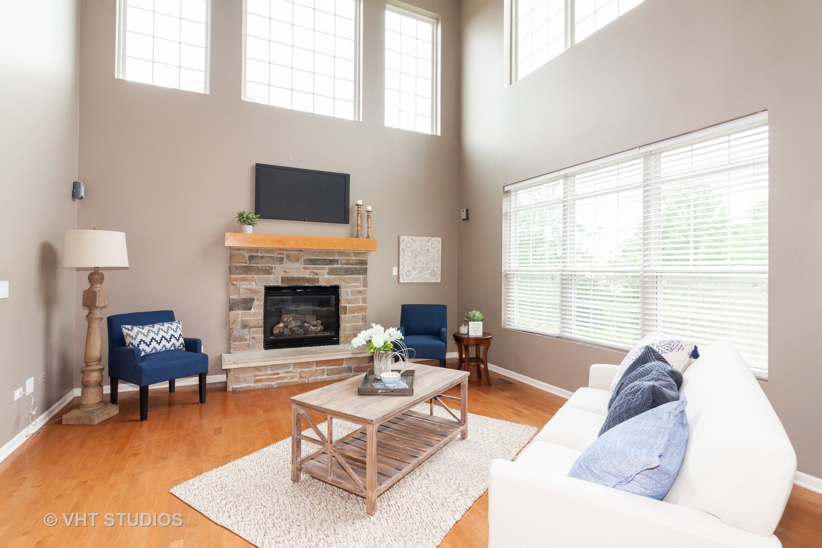 317 Stonegate Road Bolingbrook, IL 60440 - Photo 8 of 23 a living room with furniture fireplace and a large window
