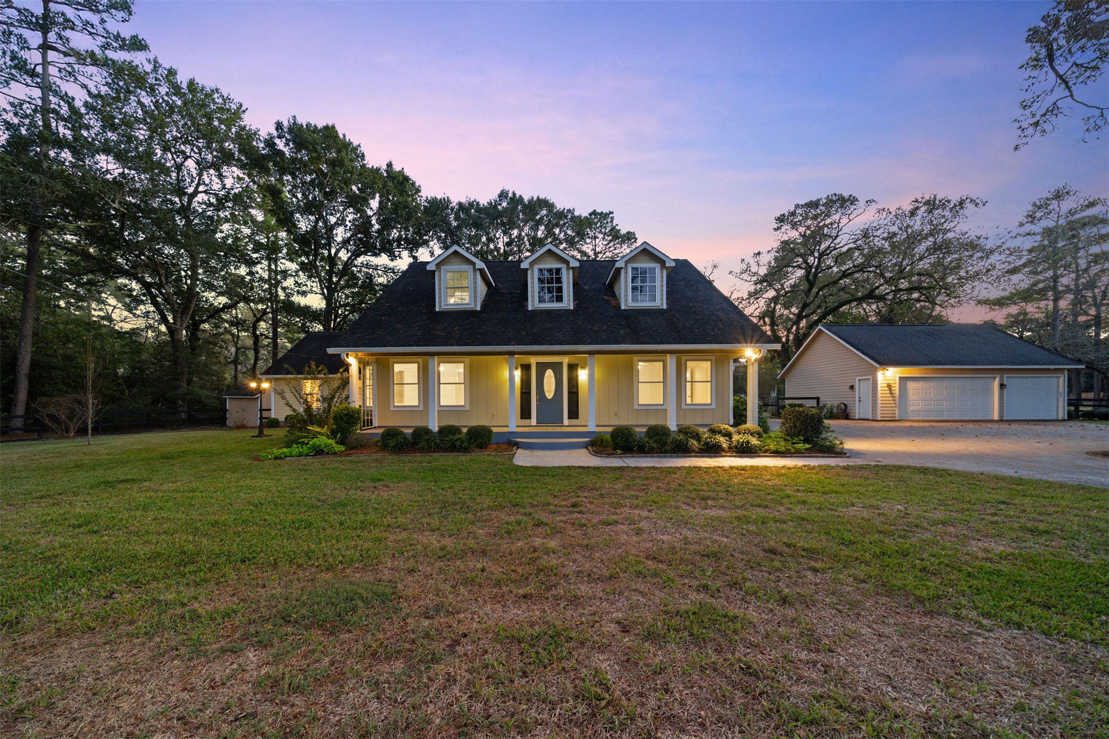22323 Roberts Cemetery Road Hockley, TX 77447 - Photo 1 of 50 a front view of a house with a yard and garage