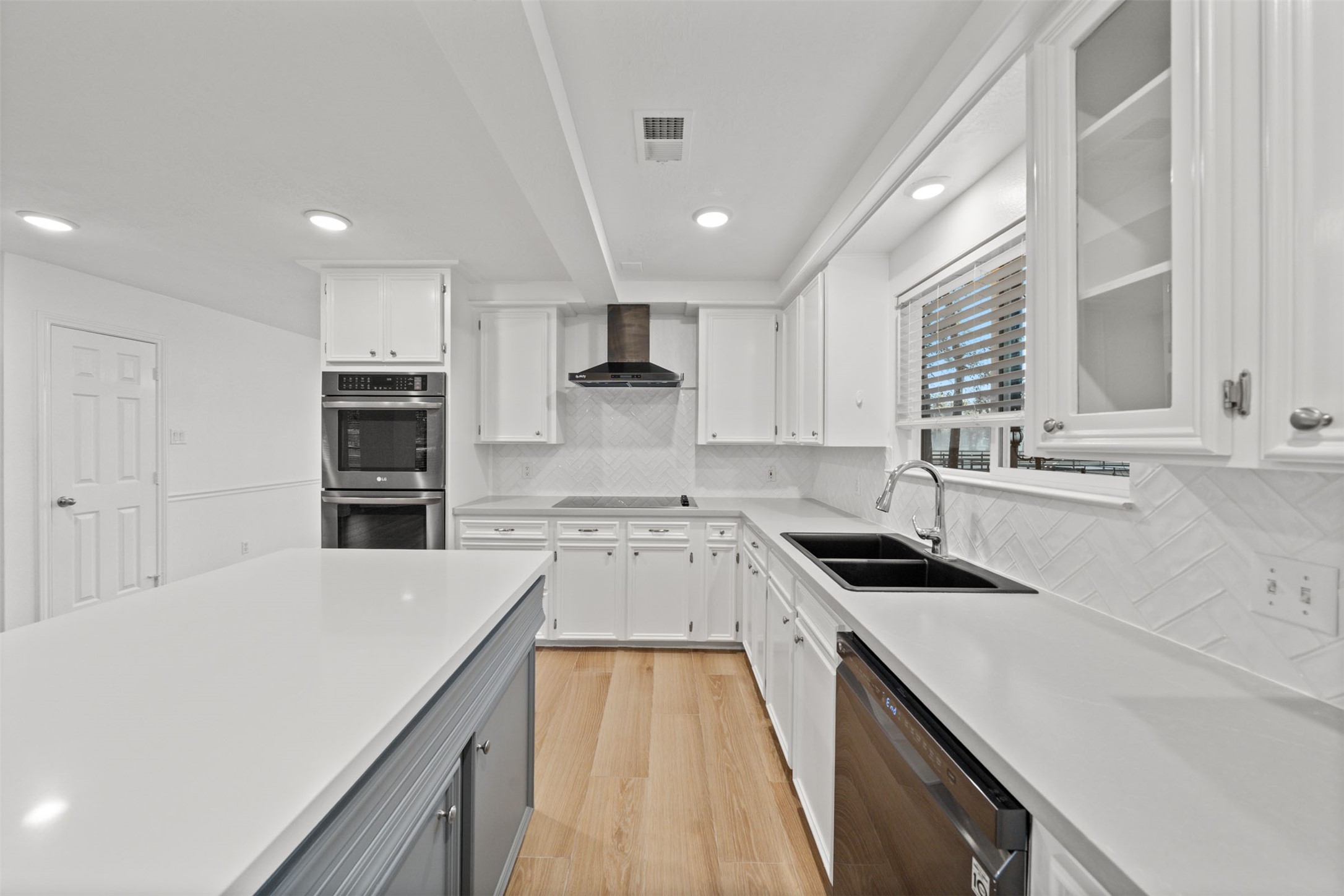 22323 Roberts Cemetery Road Hockley, TX 77447 - Photo 11 of 50 a kitchen with stainless steel appliances sink stove microwave and cabinets