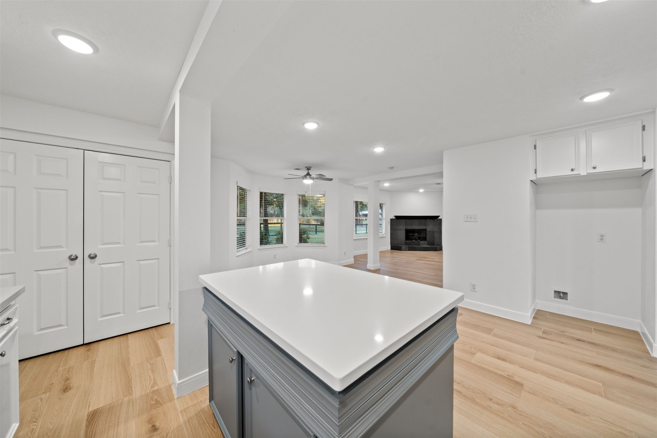 22323 Roberts Cemetery Road Hockley, TX 77447 - Photo 14 of 50 a kitchen with stainless steel appliances a white stove top oven and a refrigerator with wooden floor