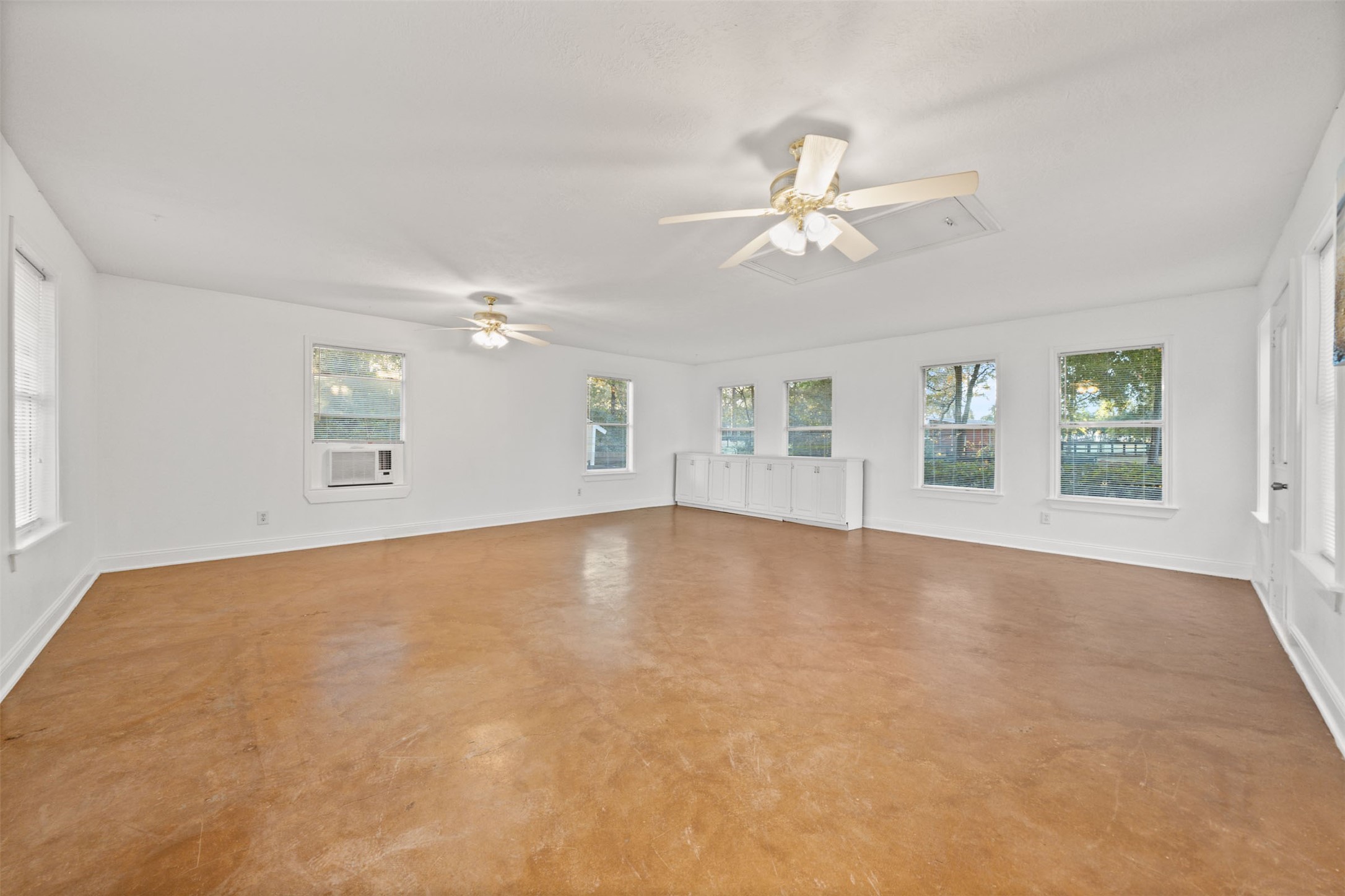 22323 Roberts Cemetery Road Hockley, TX 77447 - Photo 18 of 50 a view of an empty room with chandelier fan and wooden floor
