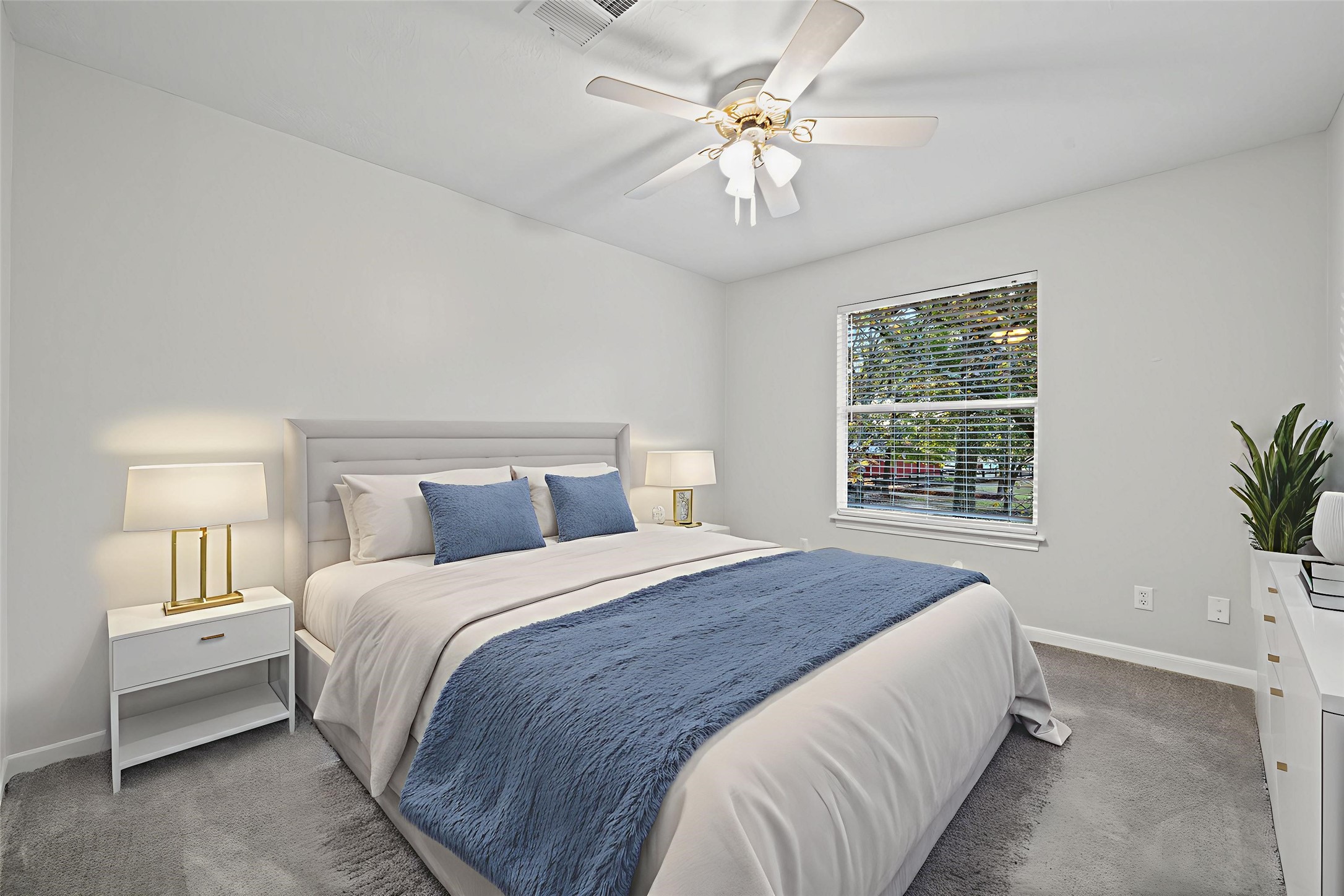22323 Roberts Cemetery Road Hockley, TX 77447 - Photo 29 of 50 a spacious bedroom with a bed a chandelier and a window