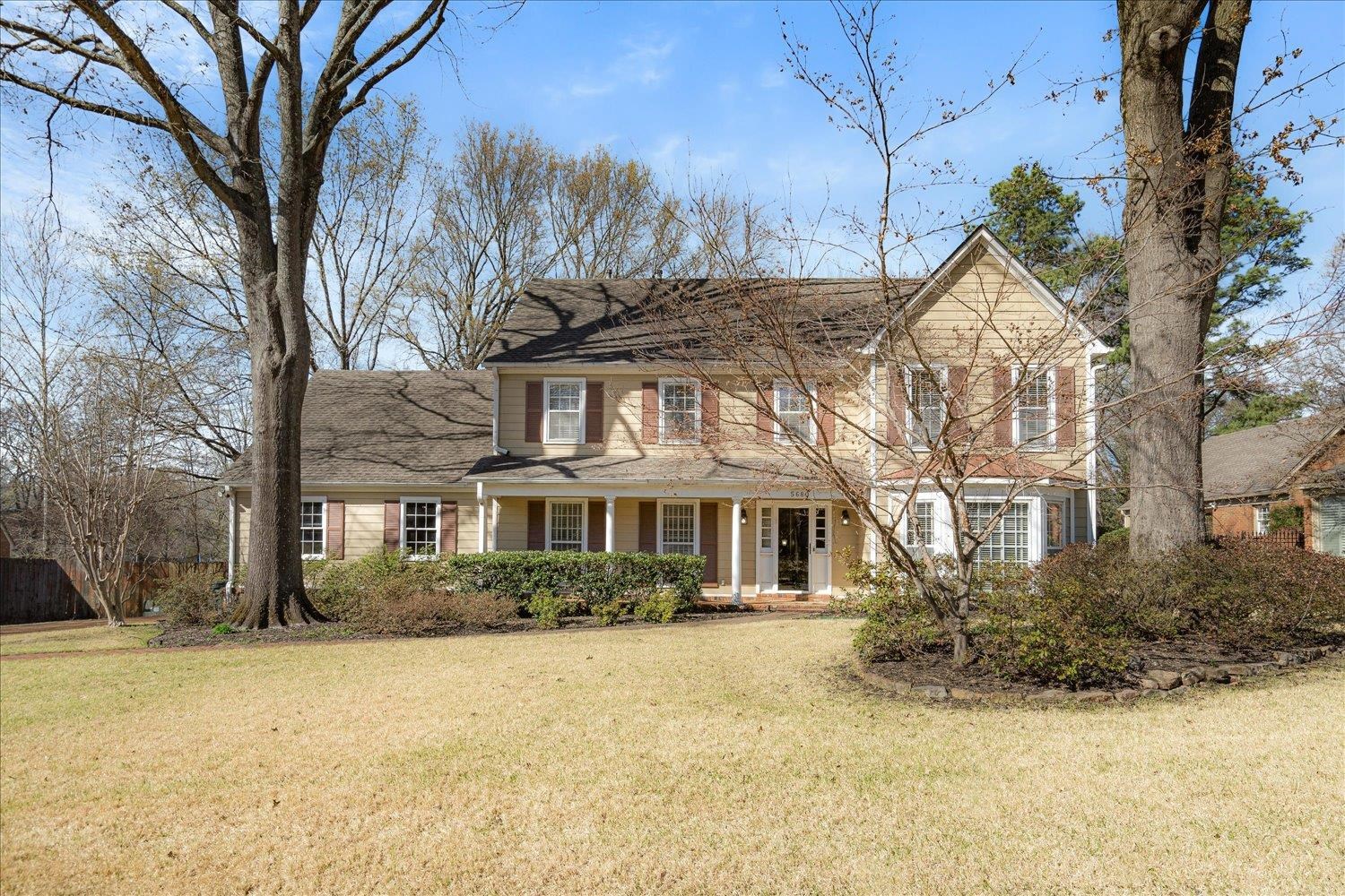 5680 Herald Square Memphis, TN 38120 - Photo 1 of 39 a front view of a house with a yard and large trees
