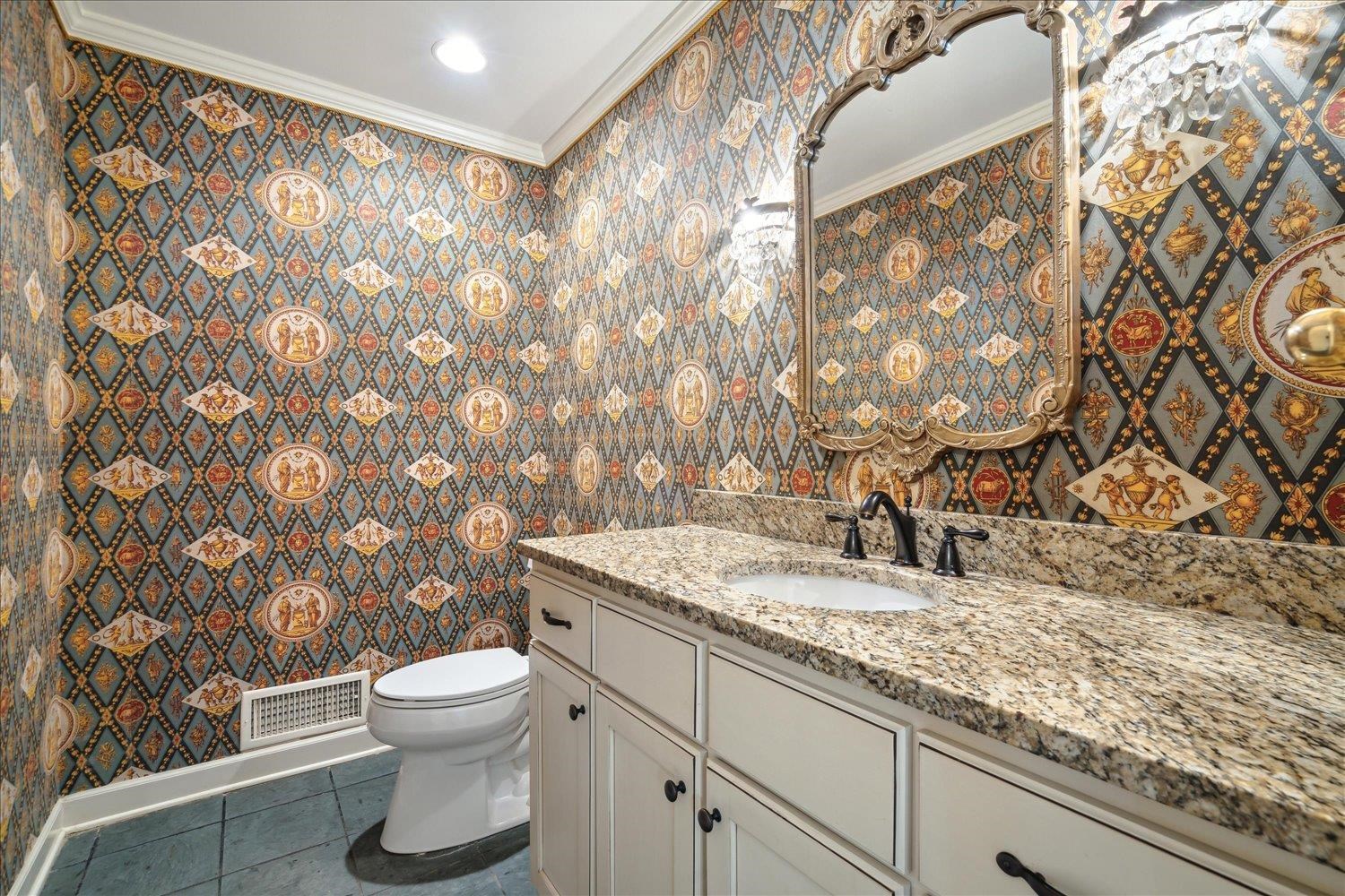 5680 Herald Square Memphis, TN 38120 - Photo 15 of 39 a bathroom with a granite countertop sink and a toilet