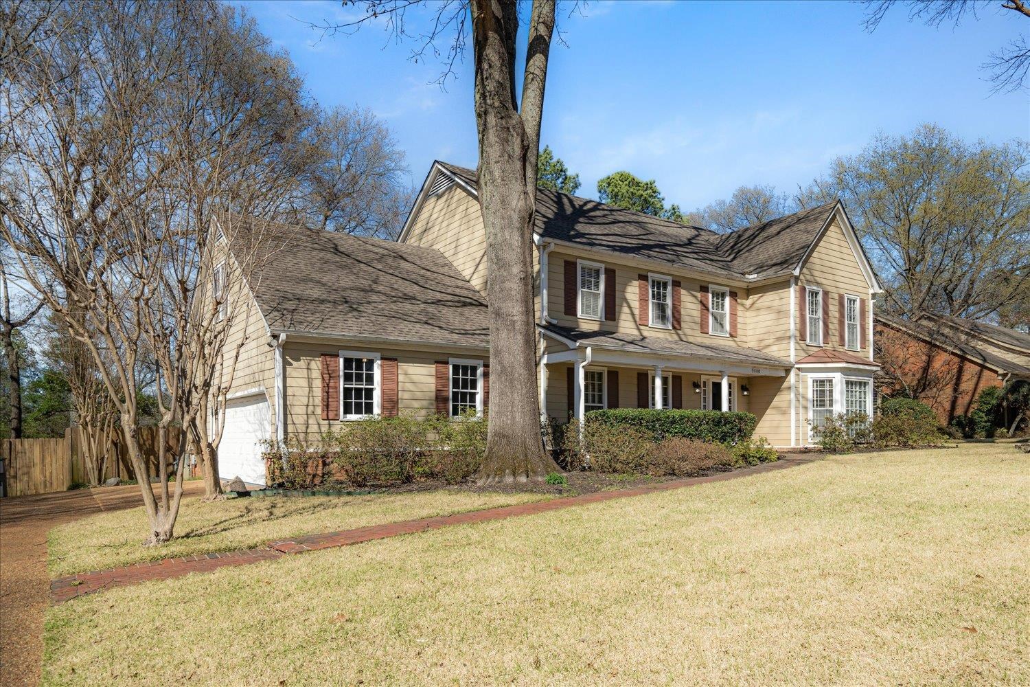 5680 Herald Square Memphis, TN 38120 - Photo 2 of 39 a front view of a house with a yard