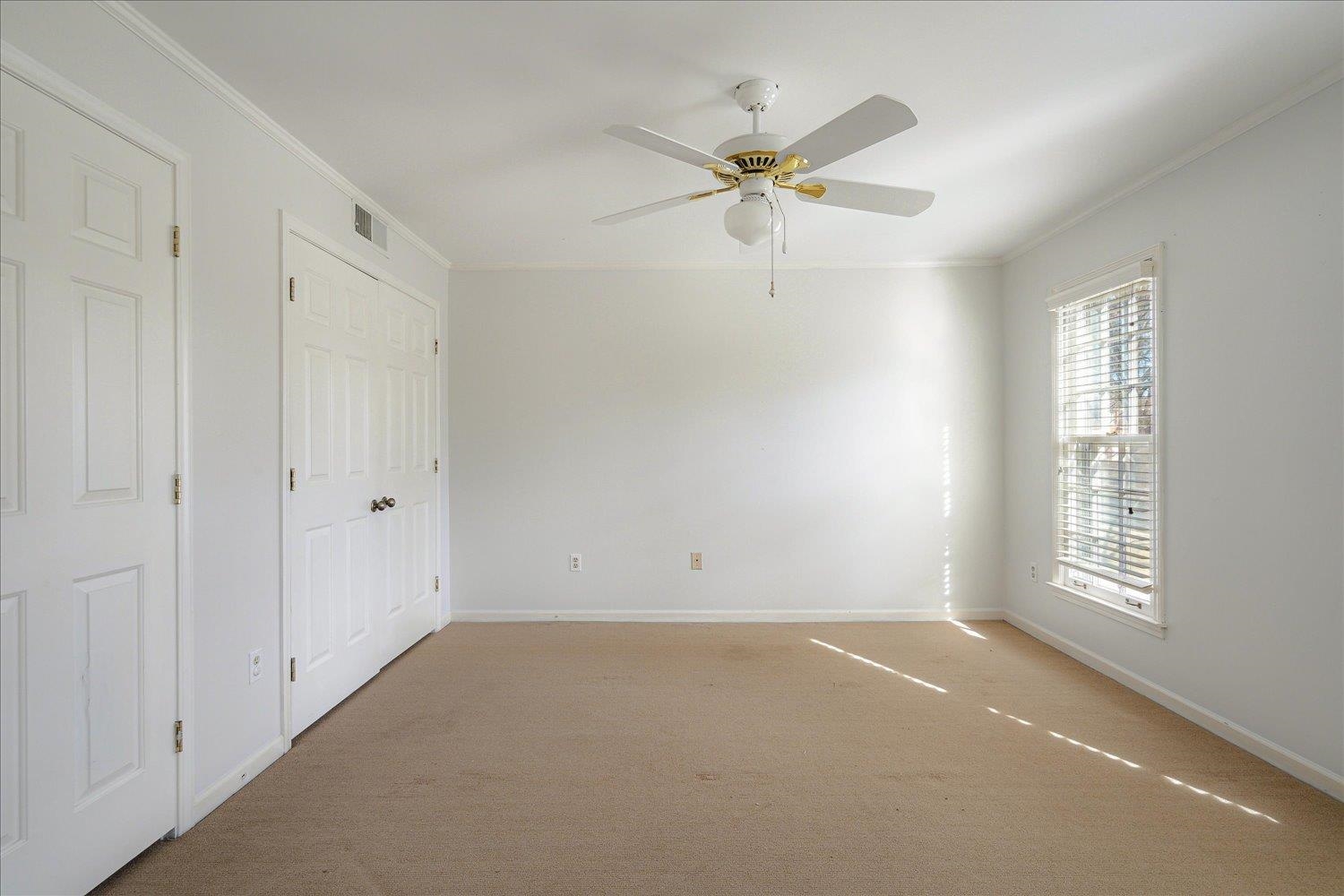 5680 Herald Square Memphis, TN 38120 - Photo 32 of 39 an empty room with windows and fan