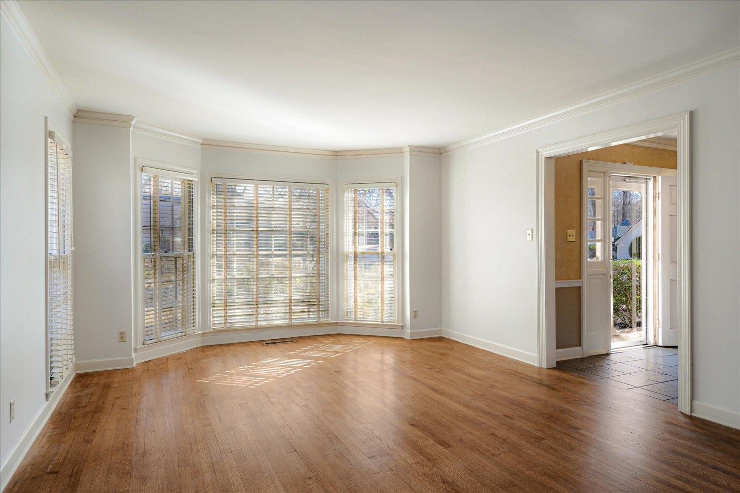 5680 Herald Square Memphis, TN 38120 - Photo 8 of 39 wooden floor in an empty room with a window