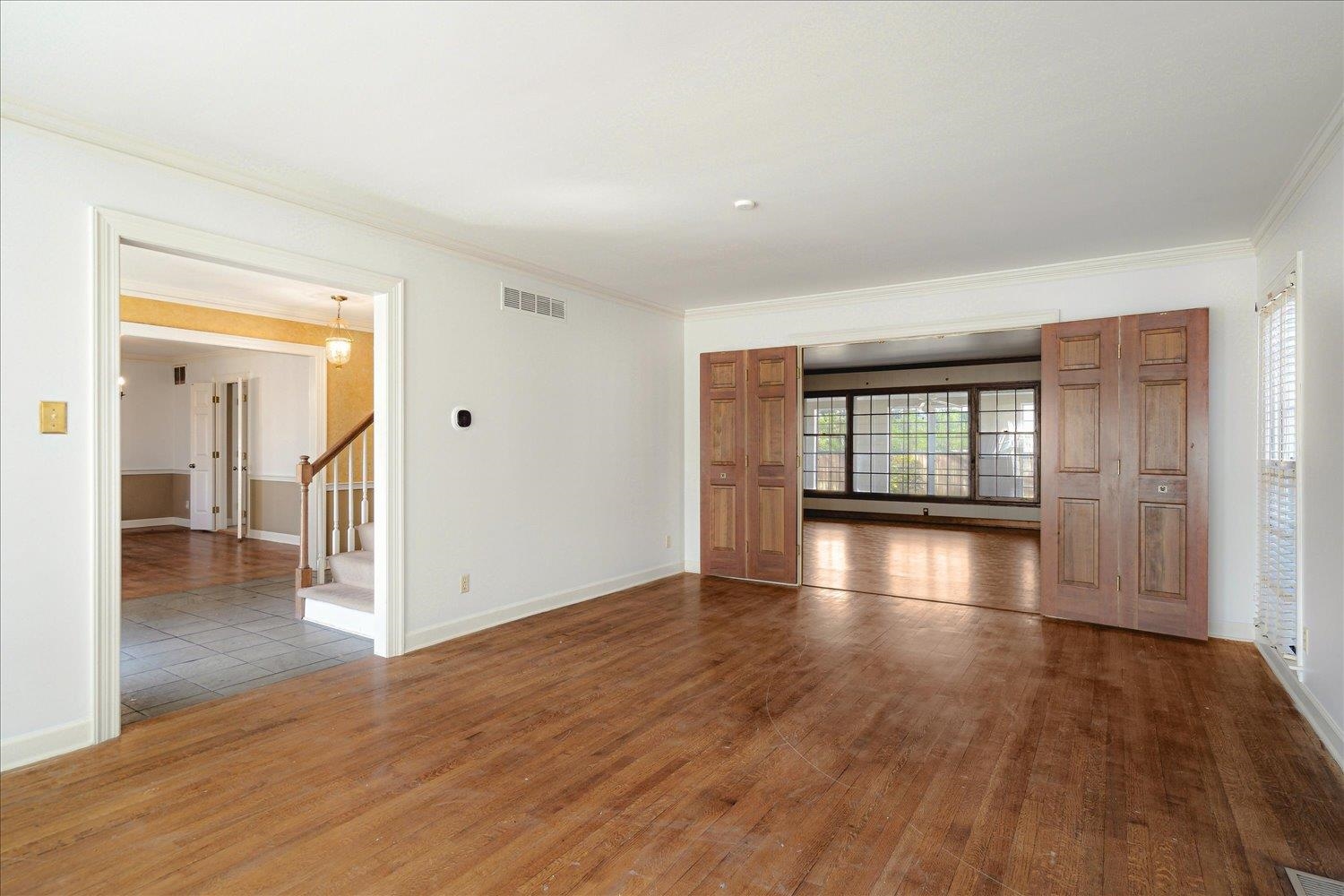 5680 Herald Square Memphis, TN 38120 - Photo 9 of 39 wooden floor in an empty room with a window