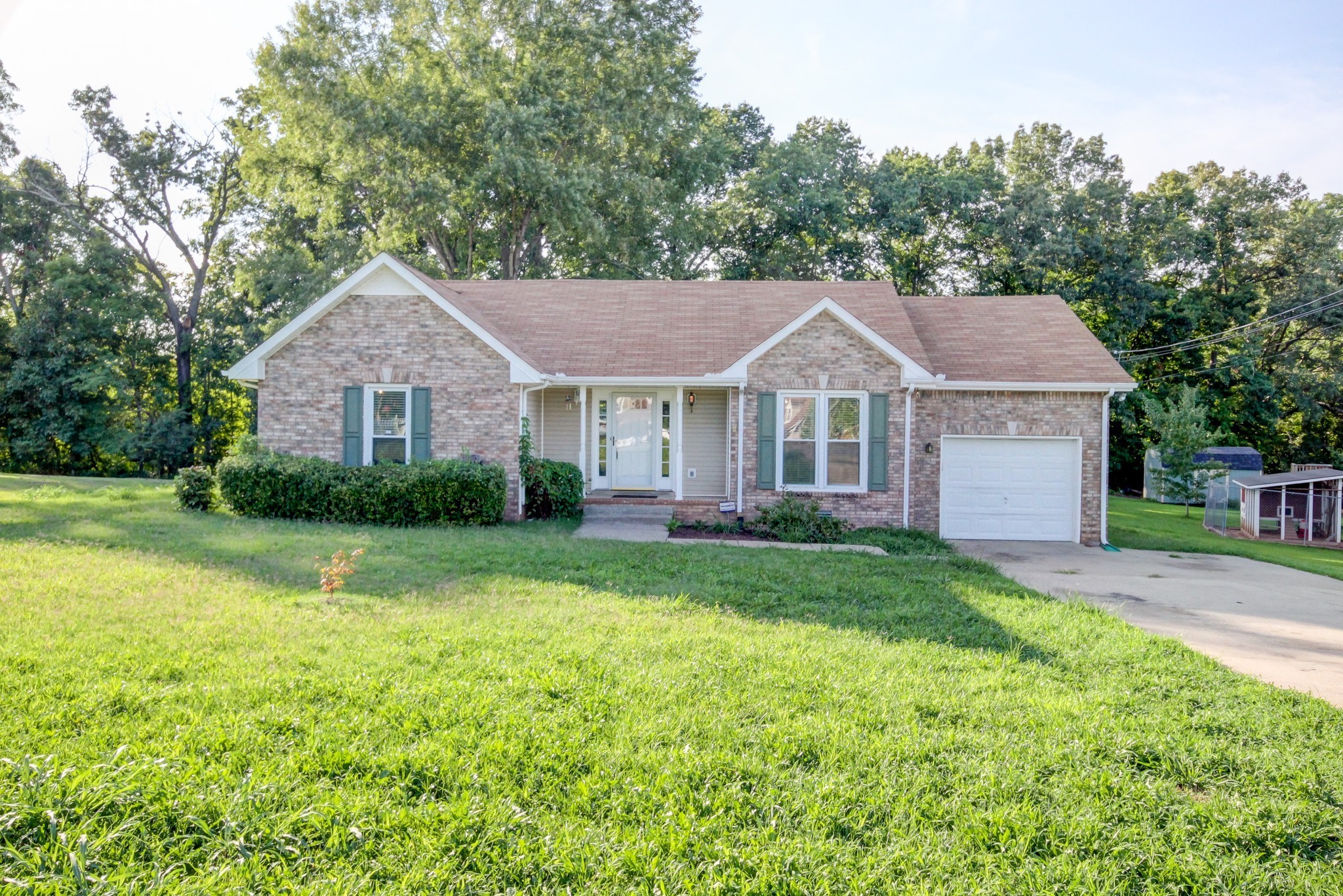 1460 McClardy Road Clarksville, TN 37042 - Photo 1 of 15 a front view of a house with yard and green space