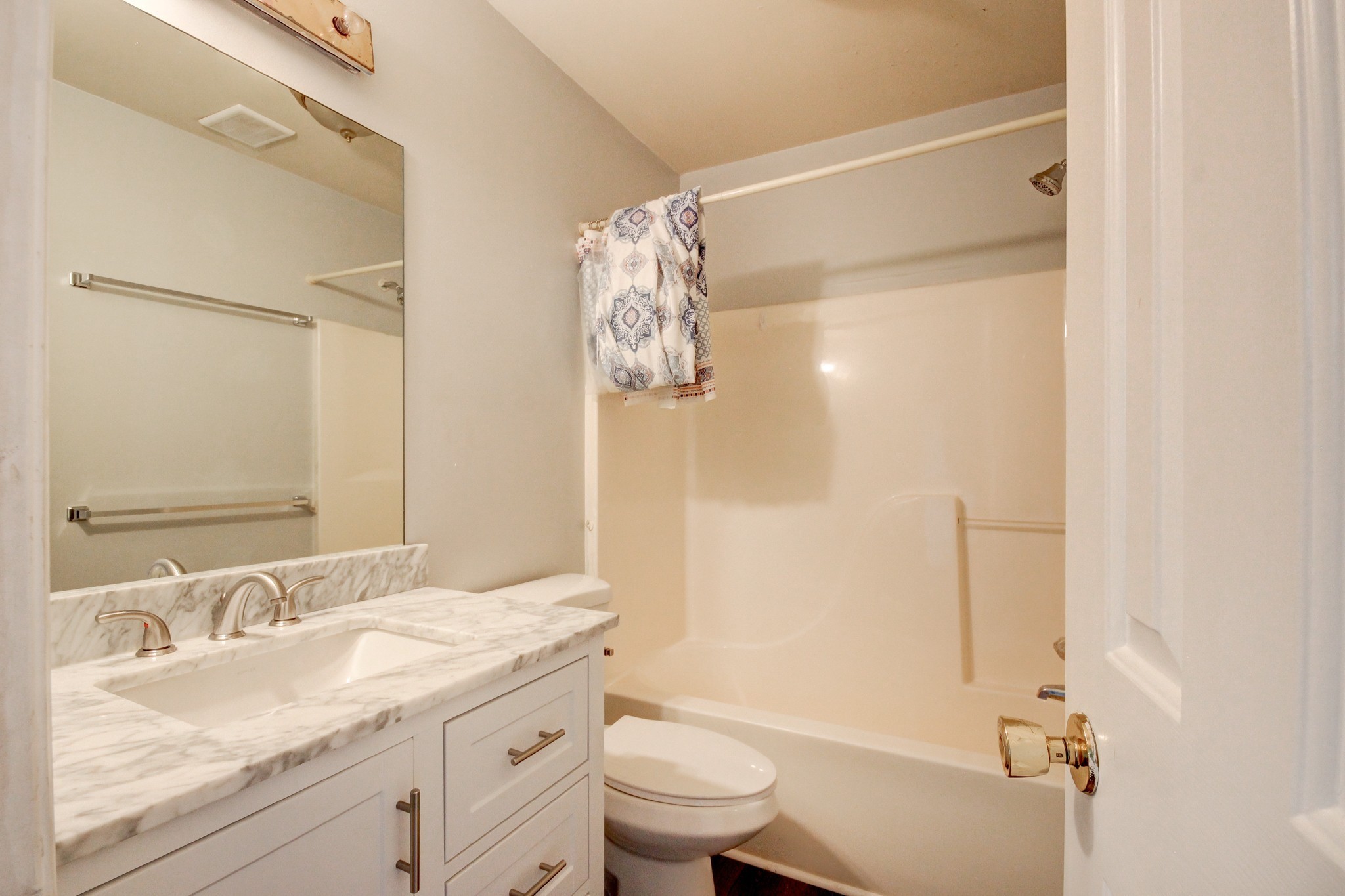 1460 McClardy Road Clarksville, TN 37042 - Photo 11 of 15 a bathroom with a granite countertop sink toilet and shower
