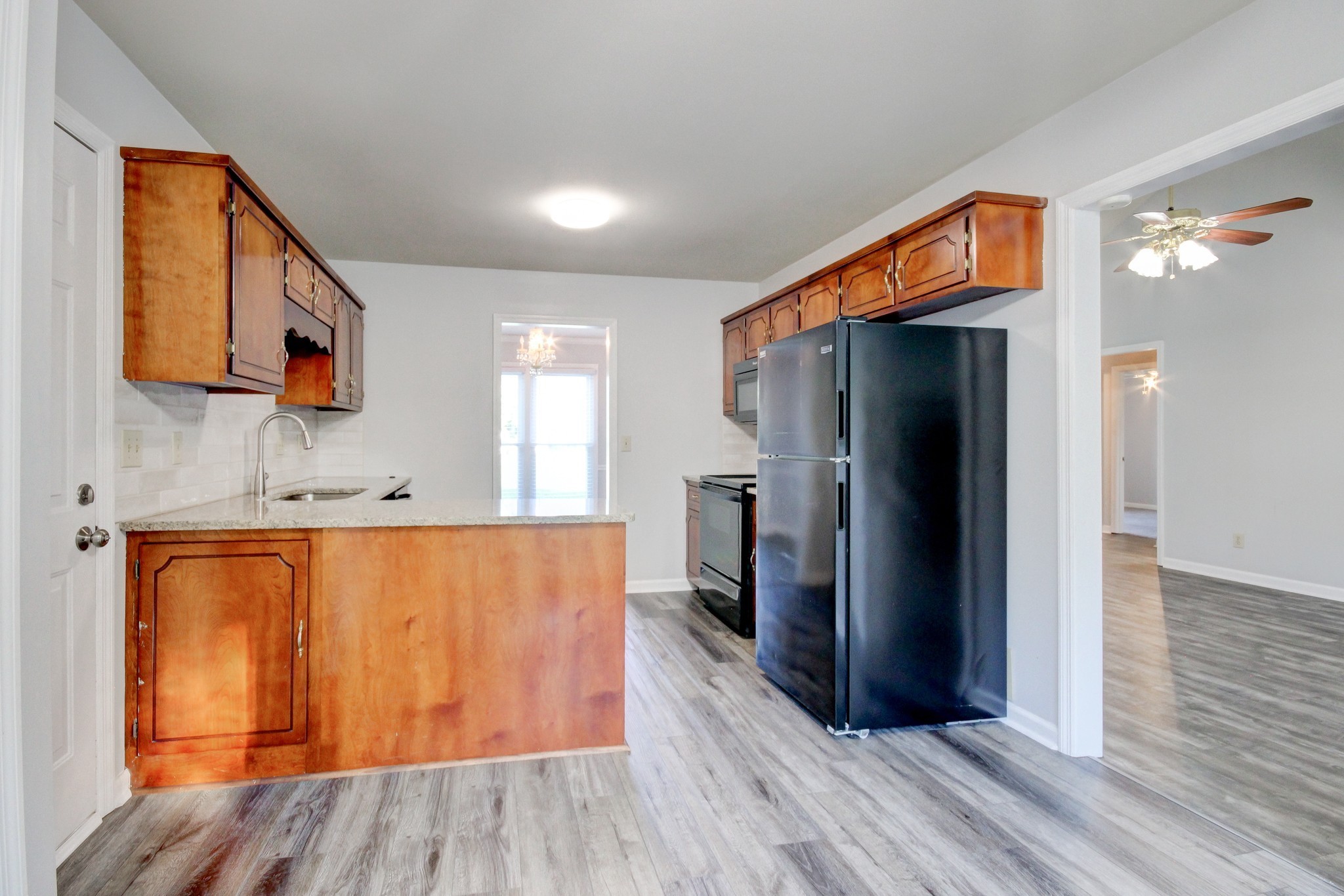1460 McClardy Road Clarksville, TN 37042 - Photo 5 of 15 a view of kitchen with stainless steel appliances granite countertop a refrigerator and a sink