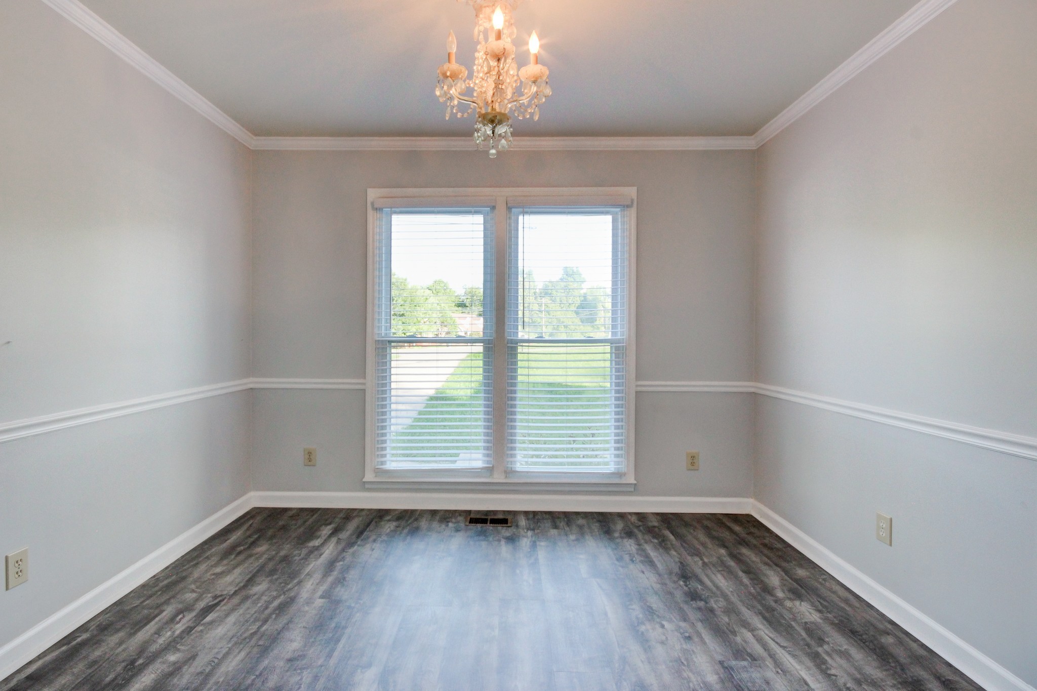 1460 McClardy Road Clarksville, TN 37042 - Photo 7 of 15 an empty room with wooden floor and windows