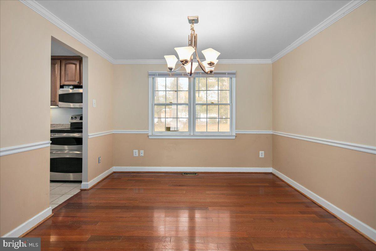12814 Pinecrest Road Herndon, VA 20171 - Photo 7 of 31 Crown and Chair Rail Moldings with Updated Light