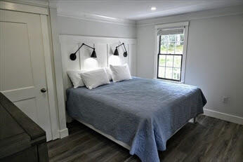 39 Nickerson Road Cotuit, MA 02635 - Photo 11 of 14 a bedroom with a bed and window