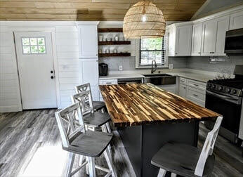 39 Nickerson Road Cotuit, MA 02635 - Photo 2 of 14 a kitchen with a table chairs and a window