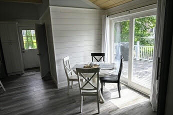 39 Nickerson Road Cotuit, MA 02635 - Photo 6 of 14 a view of a dining room with furniture and wooden floor