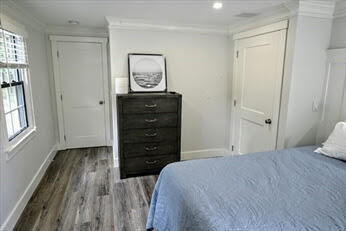 39 Nickerson Road Cotuit, MA 02635 - Photo 10 of 14 a bedroom with a bed and a window