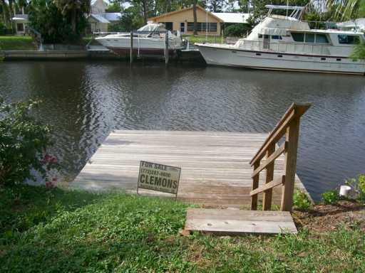 1904 Northwest Pine Tree Way Stuart, FL 34994 - Photo 5 of 8 a view of a lake with boats and a lake view