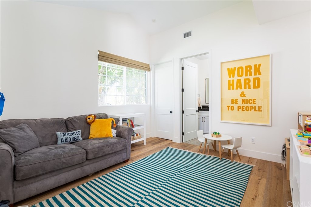 477 Magnolia Street Costa Mesa, CA 92627 - Photo 15 of 29 a bedroom with a bed and a couch