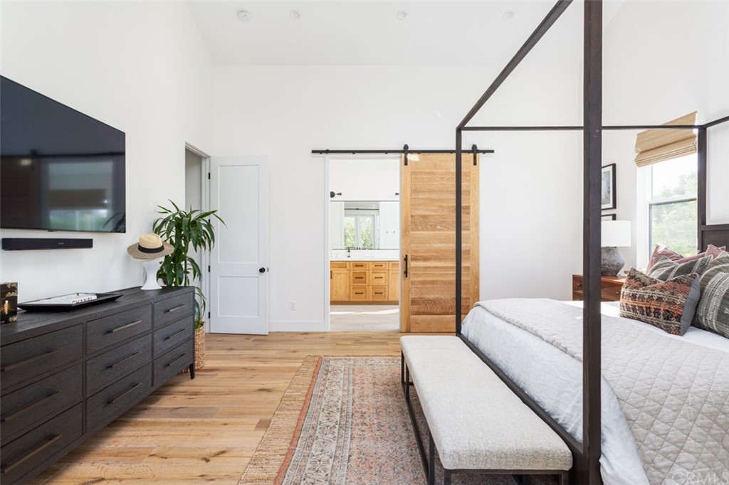 477 Magnolia Street Costa Mesa, CA 92627 - Photo 20 of 29 a living room with furniture and a flat screen tv