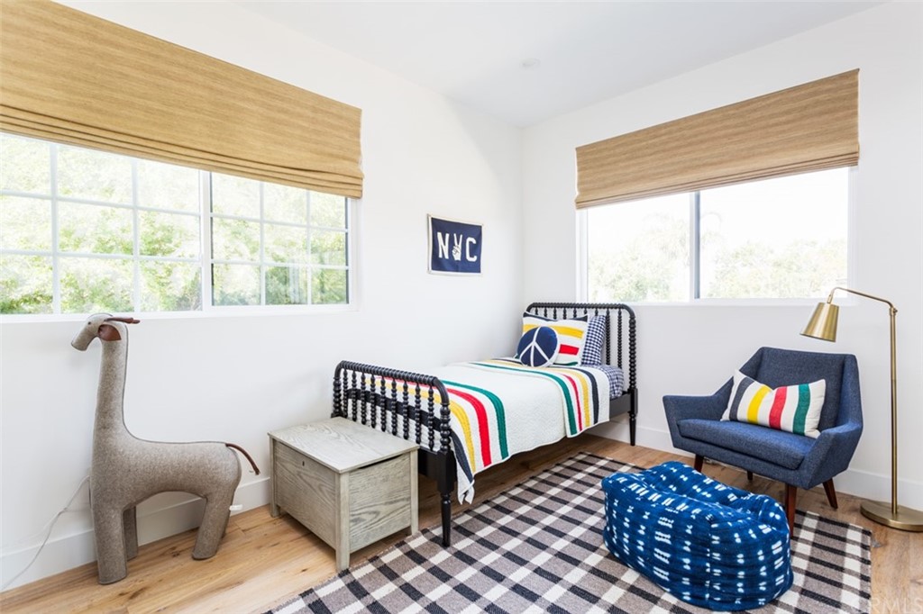 477 Magnolia Street Costa Mesa, CA 92627 - Photo 25 of 29 a bedroom with furniture and a window
