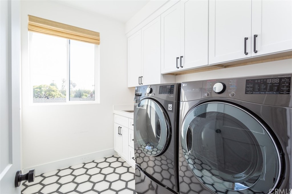 477 Magnolia Street Costa Mesa, CA 92627 - Photo 27 of 29 a utility room with dryer and washer
