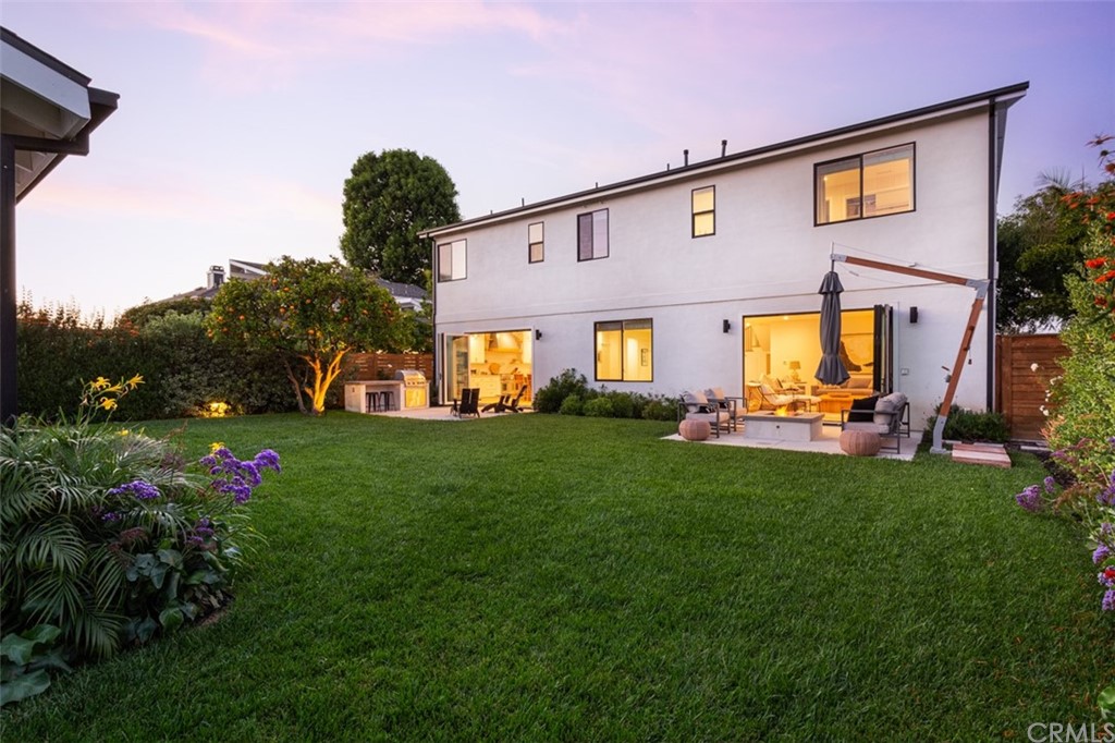477 Magnolia Street Costa Mesa, CA 92627 - Photo 28 of 29 a front view of house with a garden