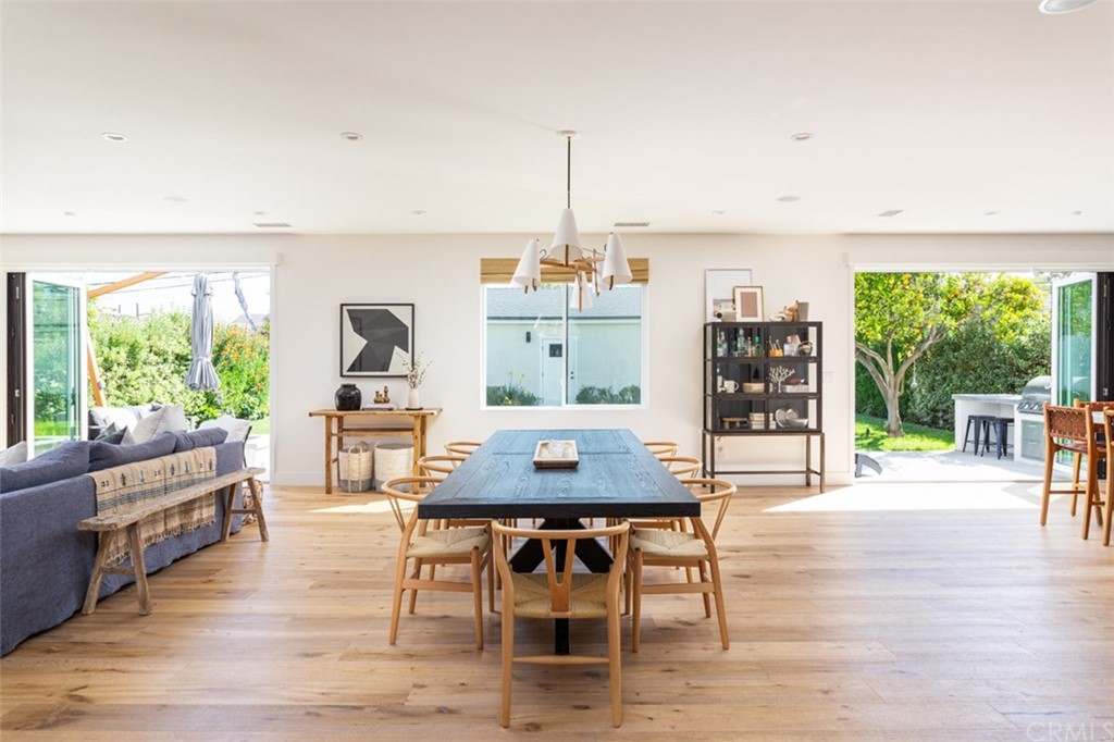 477 Magnolia Street Costa Mesa, CA 92627 - Photo 4 of 29 a view of a dining room with furniture window and wooden floor