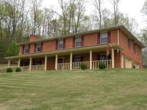 92 Oak Crest Drive Blue Ridge, VA 24064 - Photo 1 of 48 a front view of a house with a garden