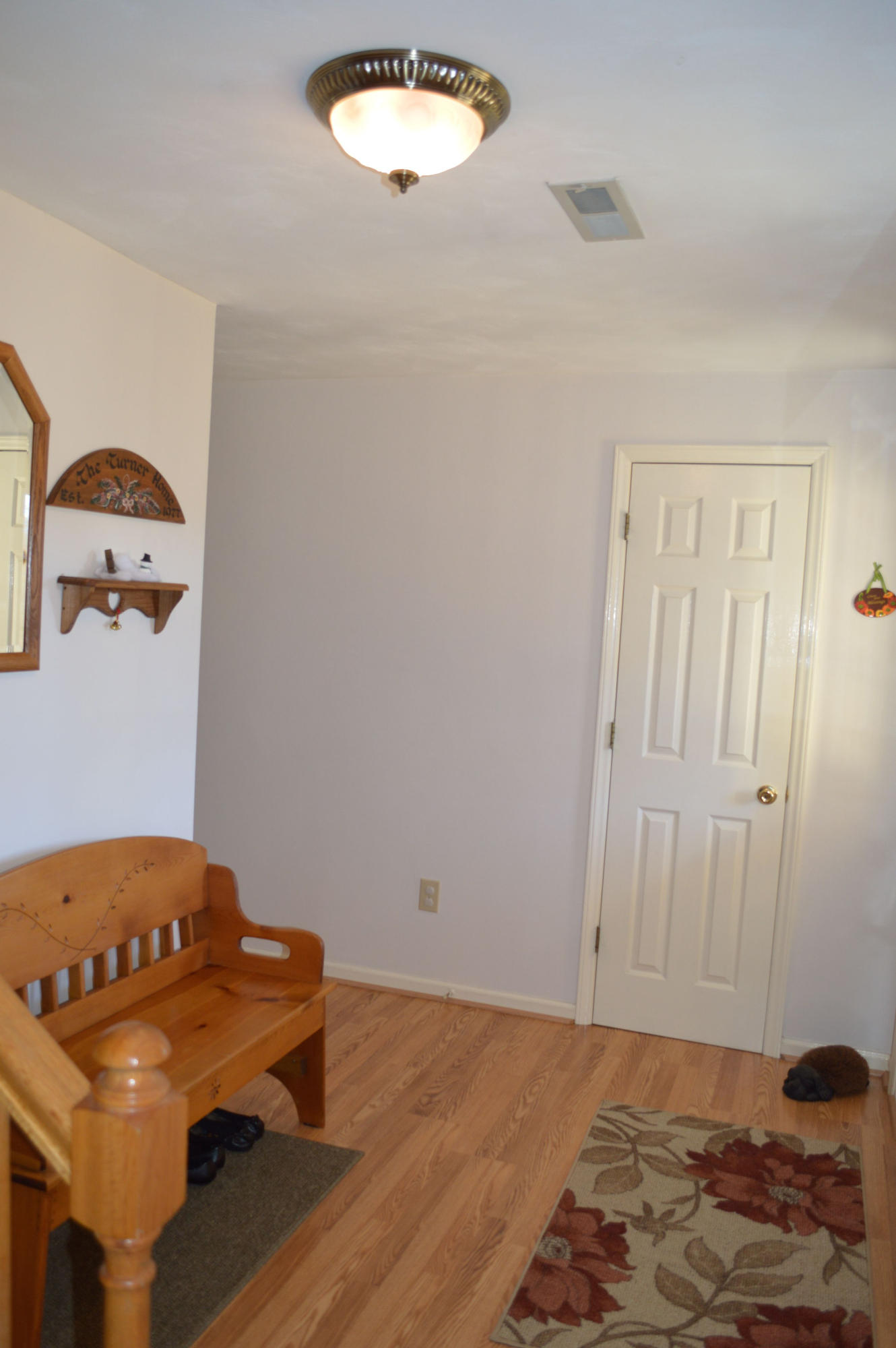92 Oak Crest Drive Blue Ridge, VA 24064 - Photo 12 of 48 a bedroom with a bed and a chandelier