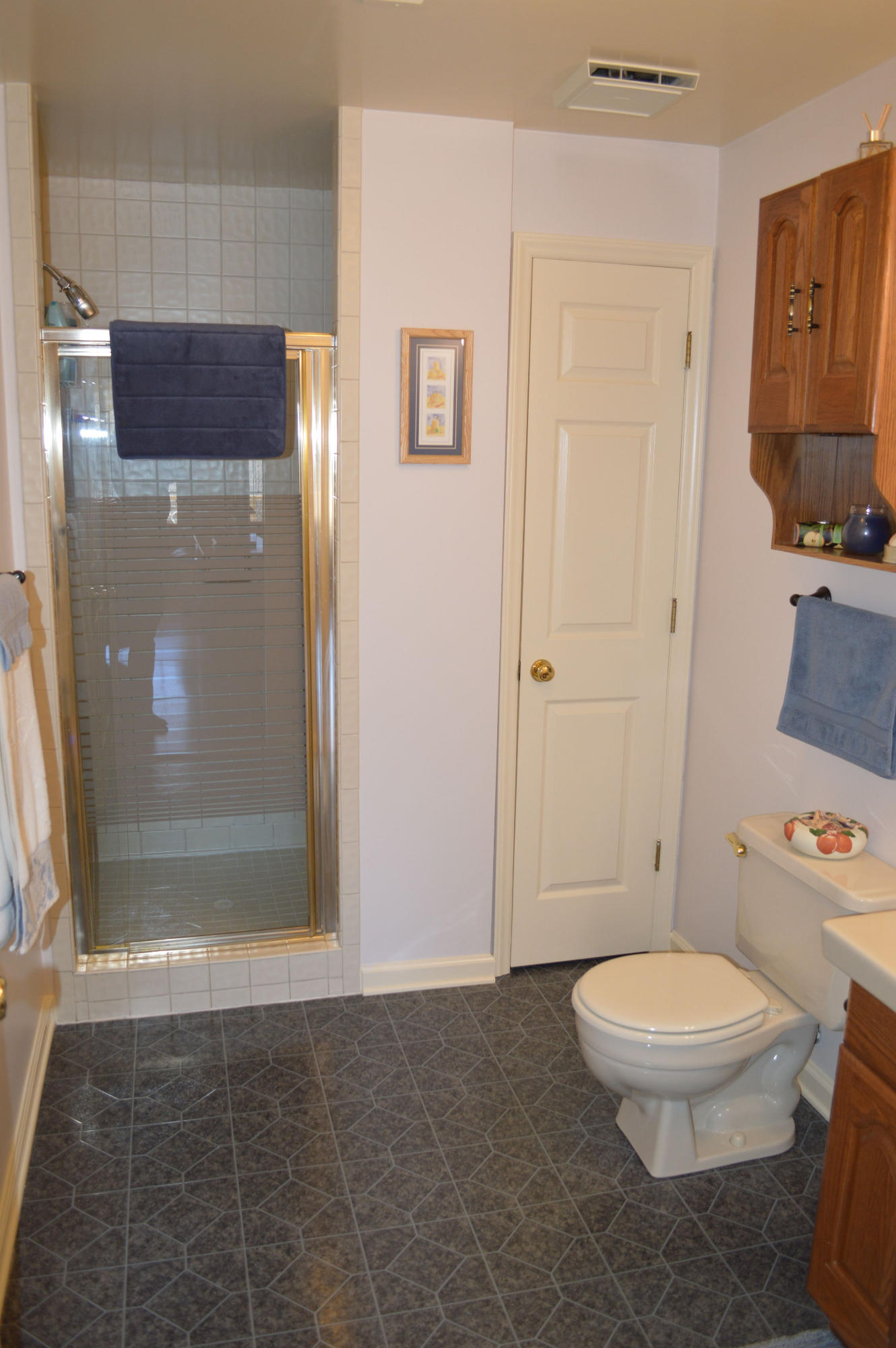 92 Oak Crest Drive Blue Ridge, VA 24064 - Photo 16 of 48 a white toilet sitting next to a bathroom sink