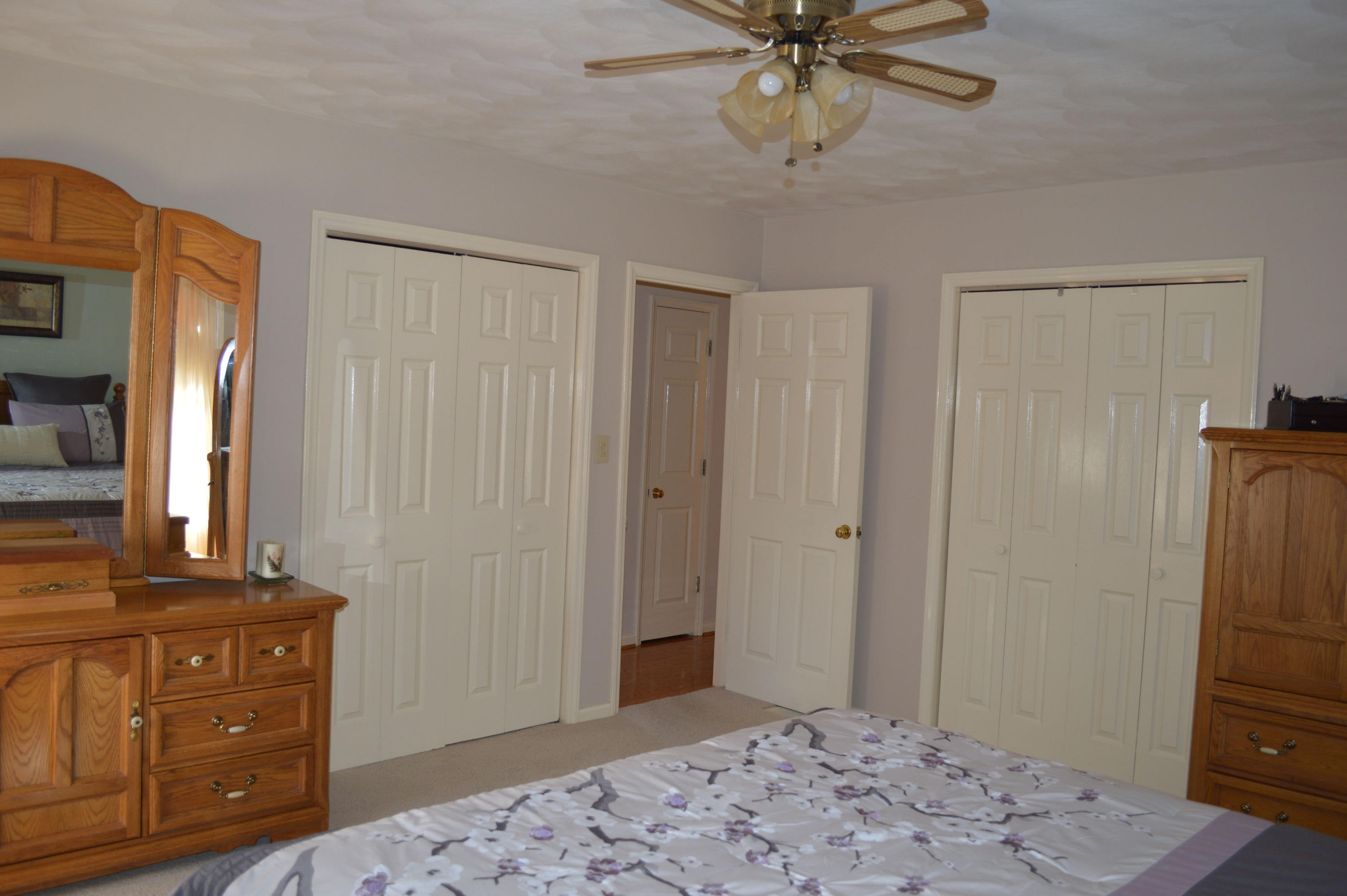 92 Oak Crest Drive Blue Ridge, VA 24064 - Photo 7 of 48 a bedroom with a bed and a mirror on the dresser
