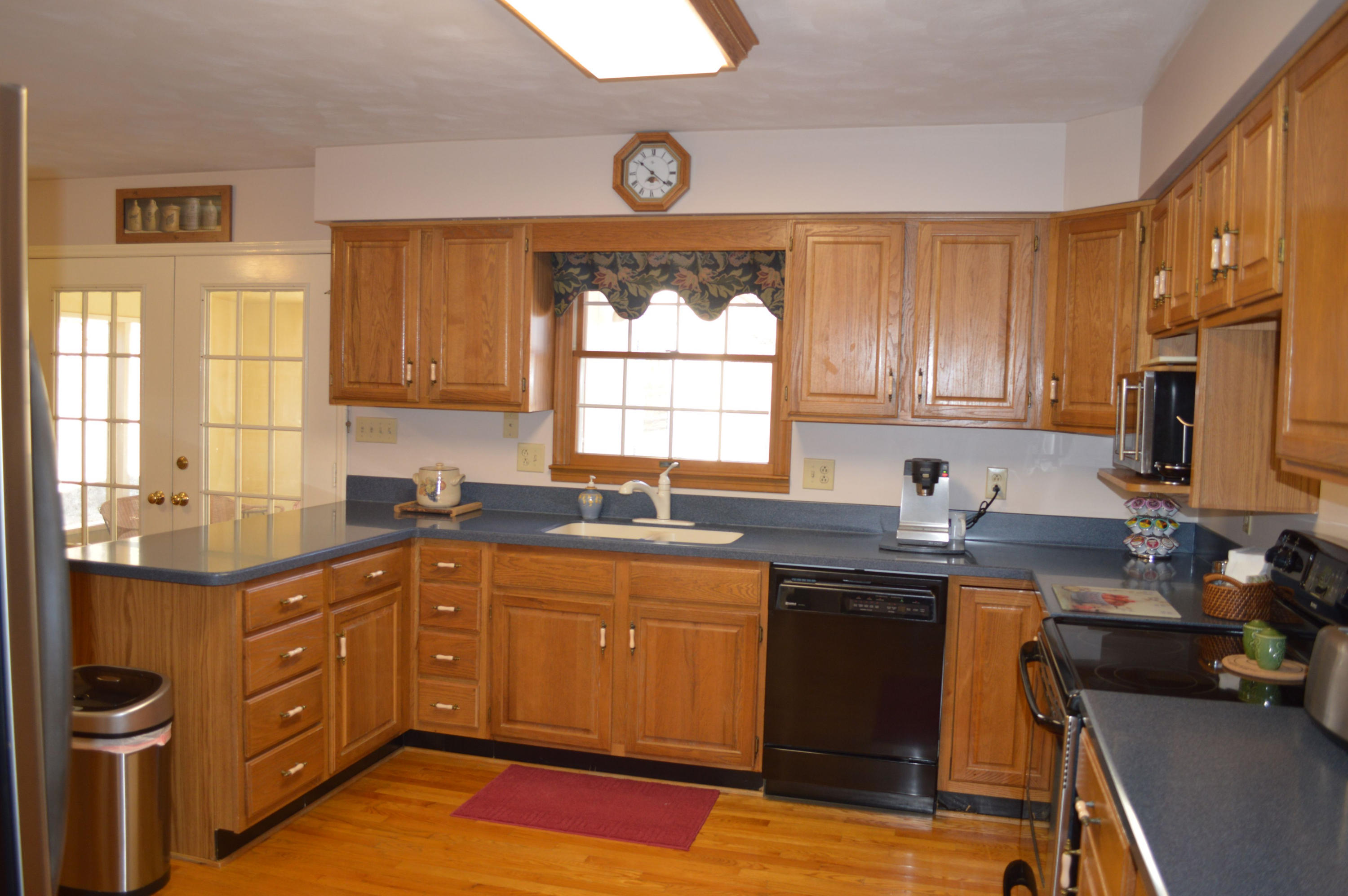 92 Oak Crest Drive Blue Ridge, VA 24064 - Photo 8 of 48 a kitchen with a sink stove and cabinets