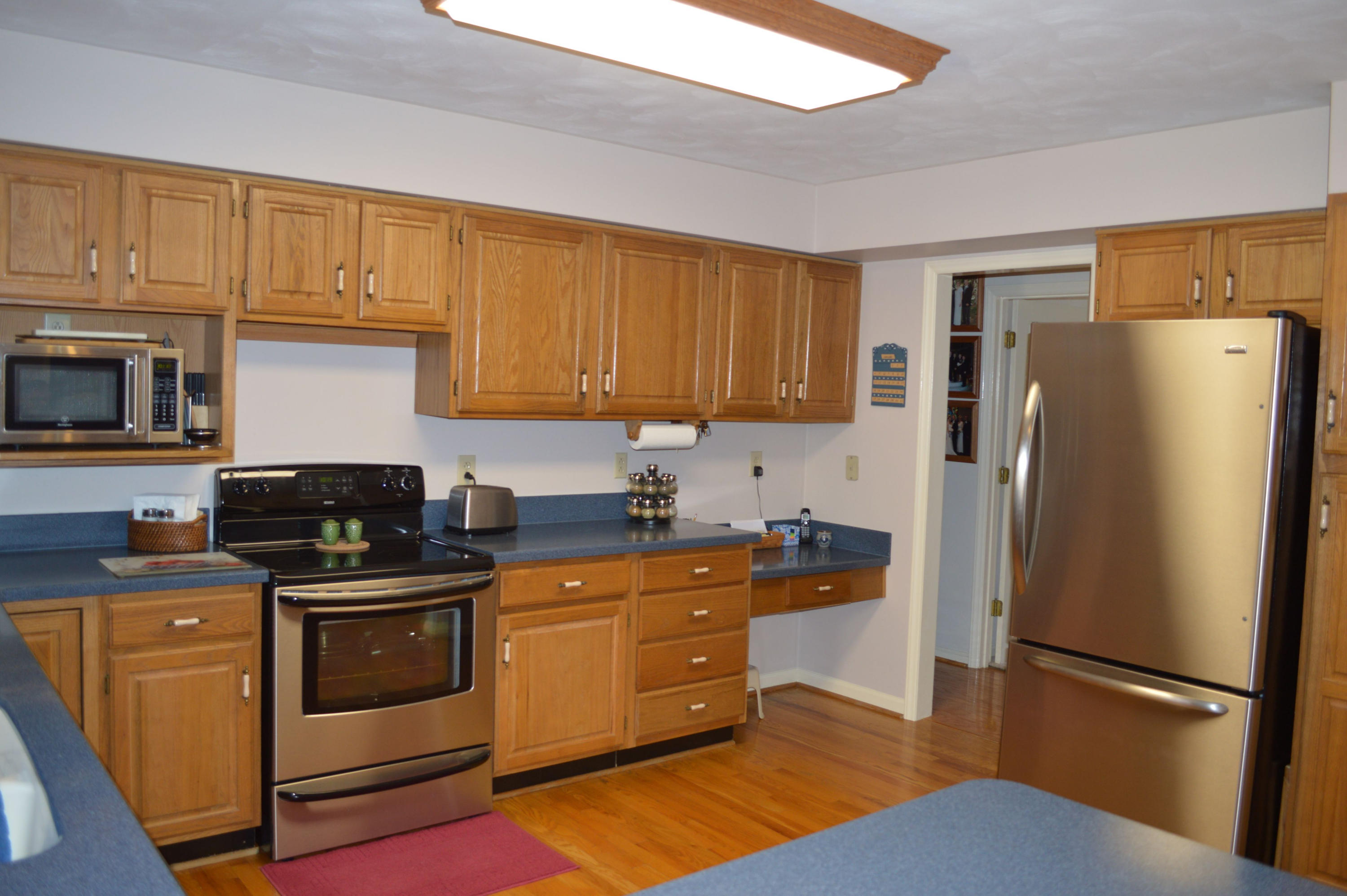 92 Oak Crest Drive Blue Ridge, VA 24064 - Photo 9 of 48 a kitchen with stainless steel appliances granite countertop a refrigerator stove and sink