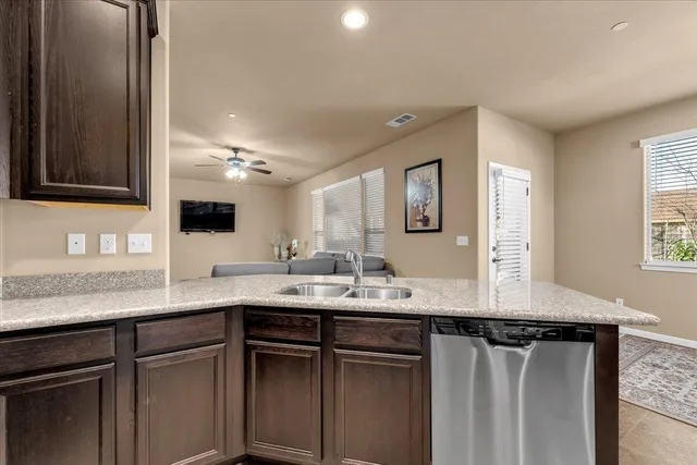 a kitchen with a sink and a mirror