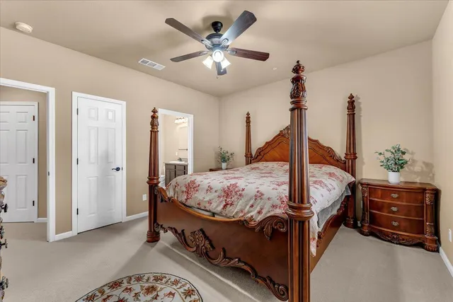 a bed room with a bed and a chandelier