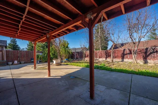 a view of a house with a yard and garage