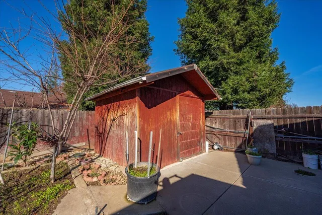 a view of a garden with a house