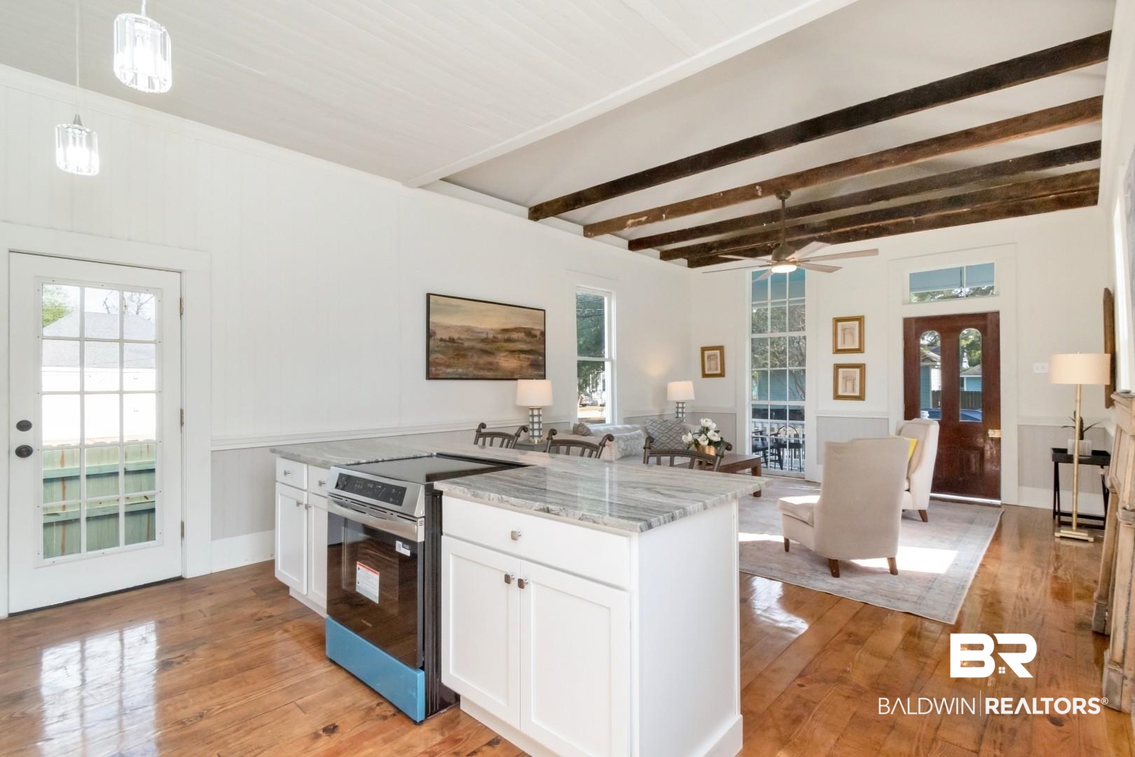 352 Marine Street Mobile, AL 36604 - Photo 8 of 20 Kitchen with stainless steel range with electric stovetop, white cabinets, light stone countertops, pendant lighting, and beam ceiling