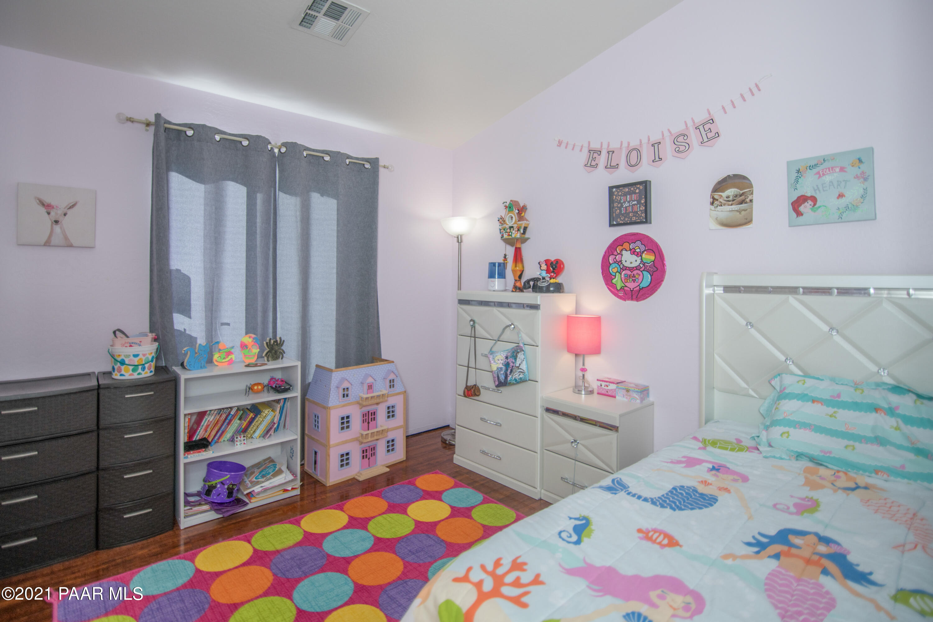 7402 East Plateau Ridge Road Prescott Valley, AZ 86315 - Photo 15 of 31 a bedroom with a bed and furniture