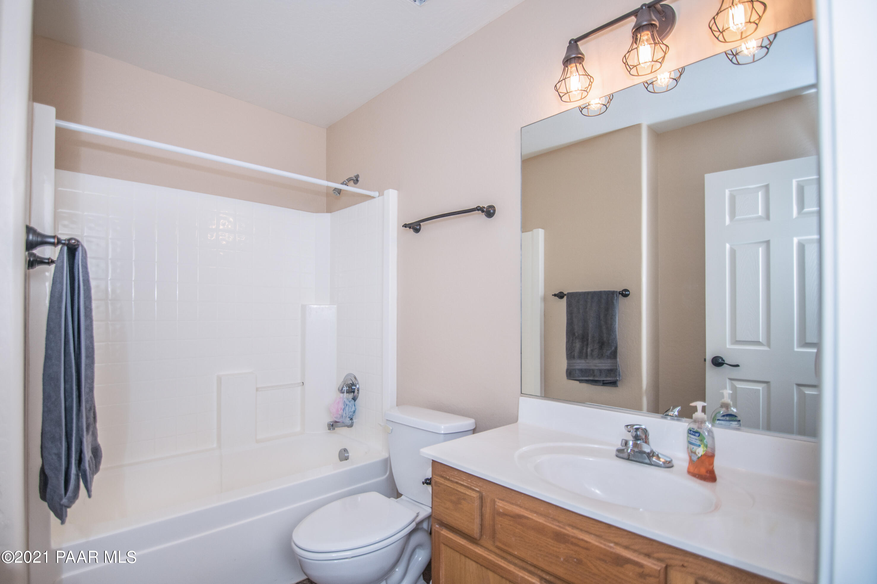 7402 East Plateau Ridge Road Prescott Valley, AZ 86315 - Photo 17 of 31 a bathroom with a sink a toilet and shower