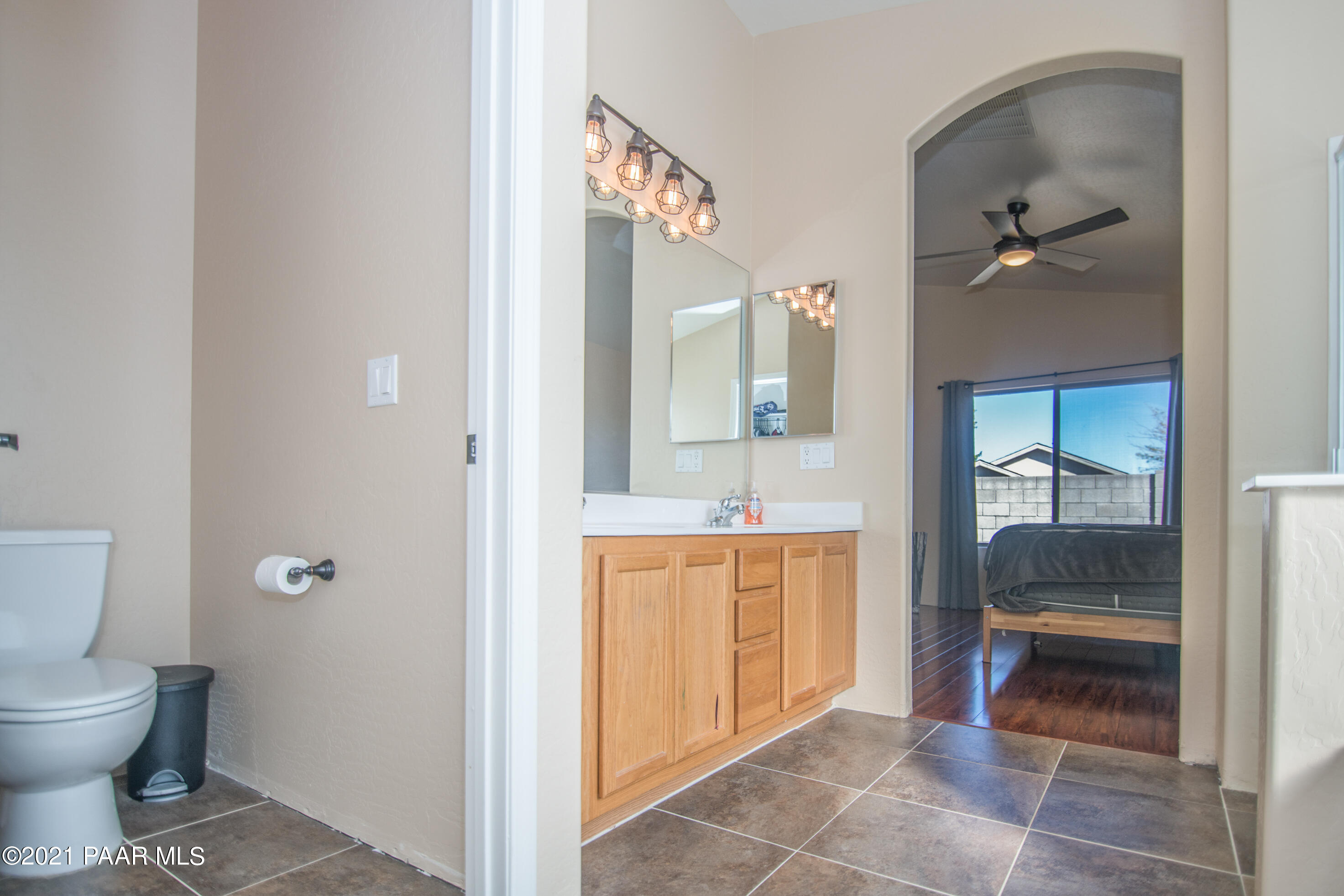 7402 East Plateau Ridge Road Prescott Valley, AZ 86315 - Photo 25 of 31 a bathroom with a toilet sink and shower