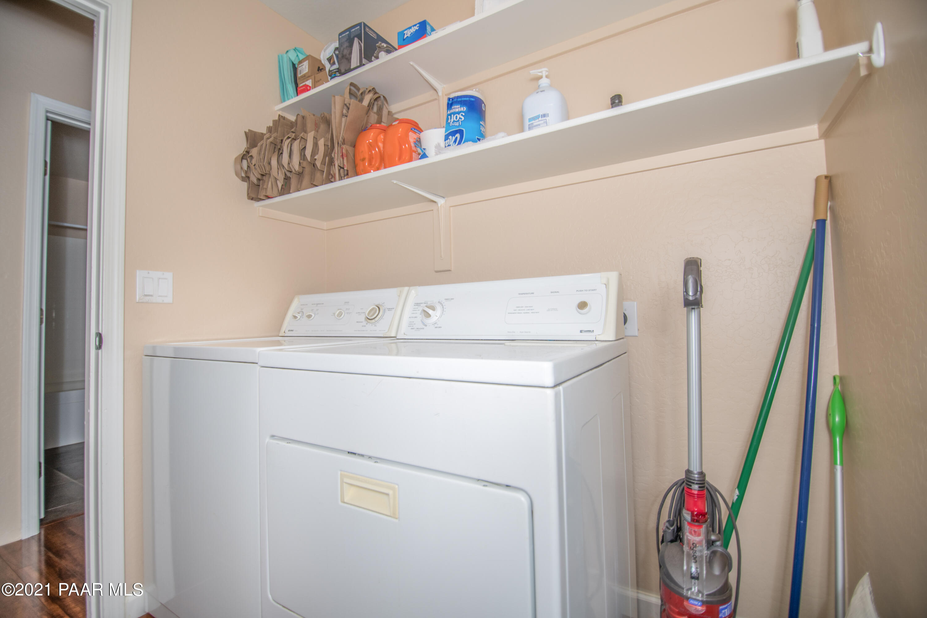 7402 East Plateau Ridge Road Prescott Valley, AZ 86315 - Photo 27 of 31 a utility room with dryer and washer